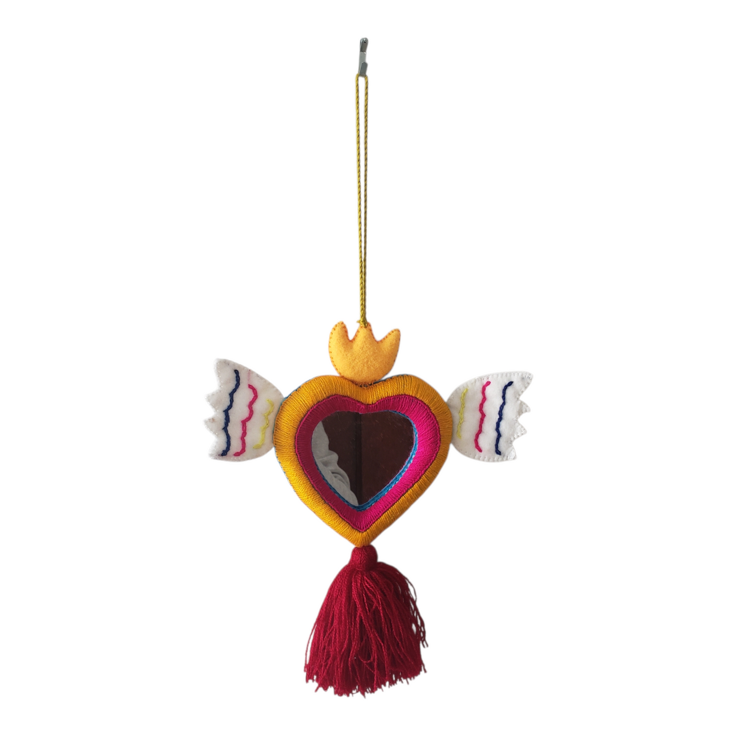 Decorative heart-shaped ornament with wings and a tassel on a white background
